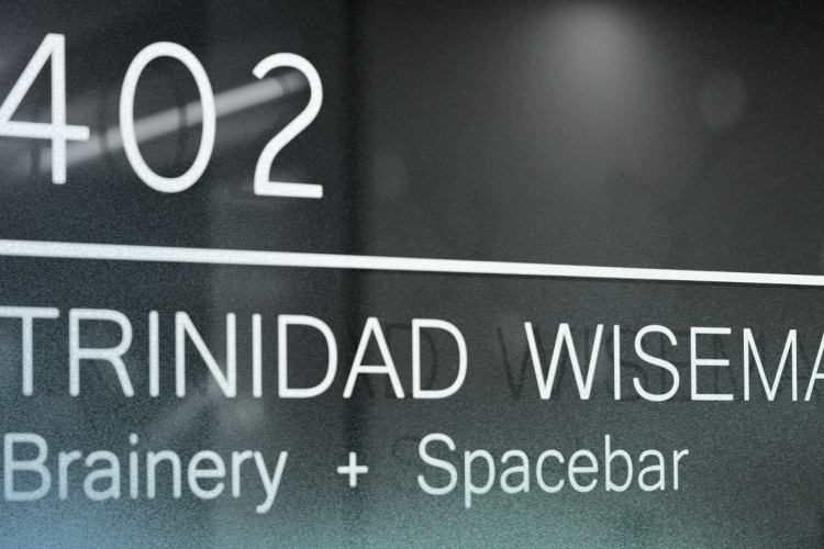 a door sign that says Brainery + Spacebar